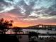 Beautiful waterfront view of the bridge at sunset from a swimming pool at 1224 S Peninsula Dr # 210, Daytona Beach, FL 32118