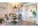 Cozy dining room with a round table, seating four, bathed in natural light and adjacent to the entry at 1224 S Peninsula Dr # 210, Daytona Beach, FL 32118