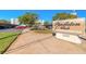 Pendleton Club Condominium featuring lush landscaping, covered parking, and a welcoming entrance sign at 1224 S Peninsula Dr # 210, Daytona Beach, FL 32118
