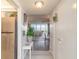 Inviting hallway leading to the living area, with plants and views of the ocean and river at 1224 S Peninsula Dr # 210, Daytona Beach, FL 32118