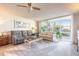Cozy living room with water views, comfortable seating, and access to a bright sunroom at 1224 S Peninsula Dr # 210, Daytona Beach, FL 32118