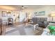 Open-concept living space with contemporary decor, including a plush sofa and dining area at 1224 S Peninsula Dr # 210, Daytona Beach, FL 32118