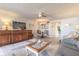Bright living area features comfortable seating, elegant decor, and adjacent dining space at 1224 S Peninsula Dr # 210, Daytona Beach, FL 32118