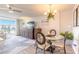 Inviting living area featuring a dining table, large television, and comfortable seating, perfect for entertaining at 1224 S Peninsula Dr # 210, Daytona Beach, FL 32118