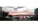 Bridge view from condo, with serene waters reflecting a colorful sunset, creating a tranquil scene at 1224 S Peninsula Dr # 210, Daytona Beach, FL 32118
