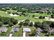 Aerial view showcasing the home's proximity to a golf course at 1329 N Old Mill Dr, Deltona, FL 32725
