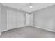 Bedroom featuring neutral carpet, fresh paint, and a ceiling fan at 1329 N Old Mill Dr, Deltona, FL 32725
