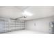 Clean, bright garage featuring ample space for parking and storage and a new garage door at 1329 N Old Mill Dr, Deltona, FL 32725