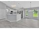 Bright, open kitchen with stainless steel appliances and ample counter space at 1329 N Old Mill Dr, Deltona, FL 32725