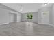 Spacious living room with tile floors, vaulted ceilings, and ample natural light at 1329 N Old Mill Dr, Deltona, FL 32725