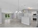 Spacious living space with modern finishes, a kitchen and dining counter at 1329 N Old Mill Dr, Deltona, FL 32725