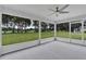 Screened patio with views of the lush yard at 1329 N Old Mill Dr, Deltona, FL 32725