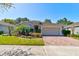 Charming single-story home featuring a brick driveway and well-maintained landscaping at 1423 Chelsea Manor Cir, Deland, FL 32724