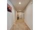 Inviting hallway with neutral paint, arched doorways and carpet flooring throughout at 1423 Chelsea Manor Cir, Deland, FL 32724