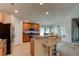 Open kitchen with stainless steel appliances, granite countertops, and a breakfast bar for casual dining and entertaining at 1423 Chelsea Manor Cir, Deland, FL 32724