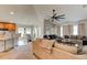 Open floor plan connecting the living room, dining area, and kitchen, creating an ideal space for entertaining guests at 1423 Chelsea Manor Cir, Deland, FL 32724
