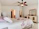 Bright main bedroom featuring natural light, a ceiling fan, and comfortable furnishings for a relaxed atmosphere at 1423 Chelsea Manor Cir, Deland, FL 32724