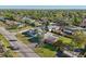 Aerial view showcasing the property's location in a neighborhood with mature trees and well-maintained streets at 1493 Derbyshire Rd, Daytona Beach, FL 32117