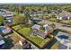Aerial view of fenced in property featuring backyard, lawn, and shed at 1493 Derbyshire Rd, Daytona Beach, FL 32117