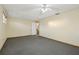 Bedroom with carpet flooring and stairs nearby at 1493 Derbyshire Rd, Daytona Beach, FL 32117