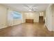 Spacious living room featuring tile flooring, natural light, and direct access to the front door at 1493 Derbyshire Rd, Daytona Beach, FL 32117