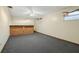 Living room with carpet flooring and brick details at 1493 Derbyshire Rd, Daytona Beach, FL 32117