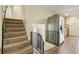 View of the staircase, kitchen, and hallway, highlighting seamless transitions at 1493 Derbyshire Rd, Daytona Beach, FL 32117
