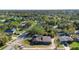 Aerial view showcases the home nestled within a lush, green neighborhood with mature trees at 1572 Darlington Ave, Deltona, FL 32725