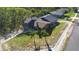 Aerial view of a quaint home, showcasing its unique architecture and well-landscaped yard at 1572 Darlington Ave, Deltona, FL 32725