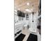 Modern bathroom featuring a sleek shower, vanity, and stylish fixtures at 1572 Darlington Ave, Deltona, FL 32725