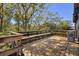 Expansive wooden deck surrounded by mature trees, offering a serene outdoor living space at 1572 Darlington Ave, Deltona, FL 32725