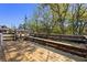 Wooden deck with built-in bench overlooking lush trees, ideal for enjoying nature and outdoor living at 1572 Darlington Ave, Deltona, FL 32725