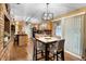 Bright dining room with modern light fixture and sliding glass door to the lanai at 1572 Darlington Ave, Deltona, FL 32725