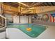 Spacious indoor pool area featuring a high ceiling, unique decor, and ample natural light at 1572 Darlington Ave, Deltona, FL 32725