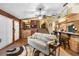 Inviting living room with a plush sofa, wooden accents, and views of the staircase at 1572 Darlington Ave, Deltona, FL 32725
