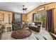Cozy living room with comfortable seating, natural light, and access to the outdoors at 1572 Darlington Ave, Deltona, FL 32725