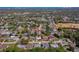 An aerial view shows a single-Gathering home with a private pool surrounded by mature trees in a residential neighborhood at 1609 Raleigh Ave, Daytona Beach, FL 32117