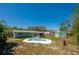 Large backyard features a unique pool, shed, and well-manicured lawn at 1609 Raleigh Ave, Daytona Beach, FL 32117