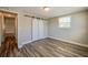 Bedroom showcasing a barn door closet, neutral walls, and a window for natural light at 1609 Raleigh Ave, Daytona Beach, FL 32117
