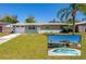 Charming single-story home featuring a well-maintained lawn, attached garage, and a refreshing swimming pool at 1609 Raleigh Ave, Daytona Beach, FL 32117