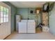 Functional laundry room features a washer, dryer, and water heater for added convenience at 1609 Raleigh Ave, Daytona Beach, FL 32117
