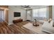 Bright staged living room featuring hardwood floors, modern furniture, and ample natural light at 1609 Raleigh Ave, Daytona Beach, FL 32117