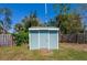 Backyard shed with a charming door and walkway, offering extra storage space at 1609 Raleigh Ave, Daytona Beach, FL 32117