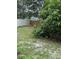 Backyard features lush greenery, mature trees, and a partial fence line at 1812 Leather Fern Dr, Ocoee, FL 34761