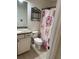 Bathroom featuring granite countertop, tile flooring, and tiled shower at 1812 Leather Fern Dr, Ocoee, FL 34761