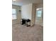 Neutral carpeted bedroom with two windows providing natural light and neutral paint at 1812 Leather Fern Dr, Ocoee, FL 34761