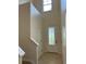 Light-filled entryway with high ceilings and decorative glass front door at 1812 Leather Fern Dr, Ocoee, FL 34761