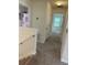 Upstairs hallway with carpet flooring leading to the bathroom and bedroom at 1812 Leather Fern Dr, Ocoee, FL 34761