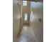 Hallway with tile floors leads to the front door at 1812 Leather Fern Dr, Ocoee, FL 34761