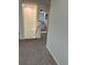 Upstairs hallway with carpet flooring leading to the bathroom at 1812 Leather Fern Dr, Ocoee, FL 34761
